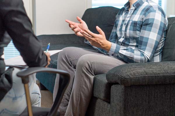 Man,Talking,And,Waving,Hands,In,Therapy,Session,With,Psychiatrist,
